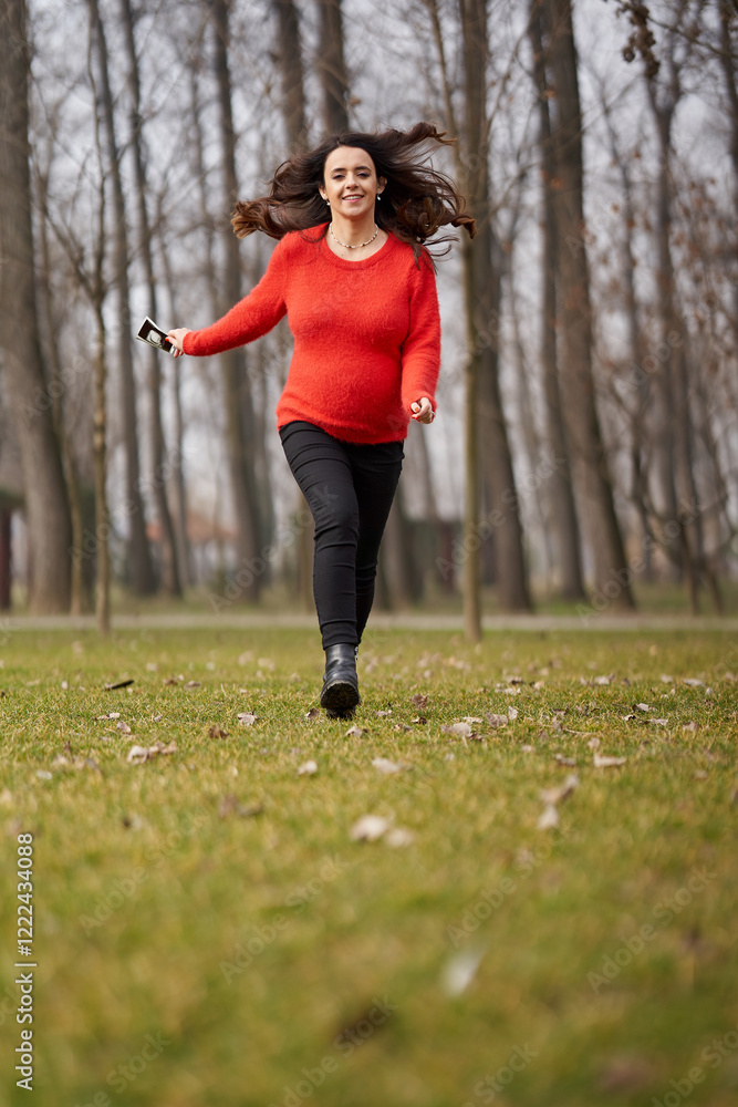 Pregnant woman running with ultrasound outdoors Pregnant woman running with ultrasound outdoors