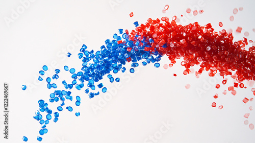 A curved stream of red and blue micro pellets flowing dynamically in the air on a white background creating an abstract wave

