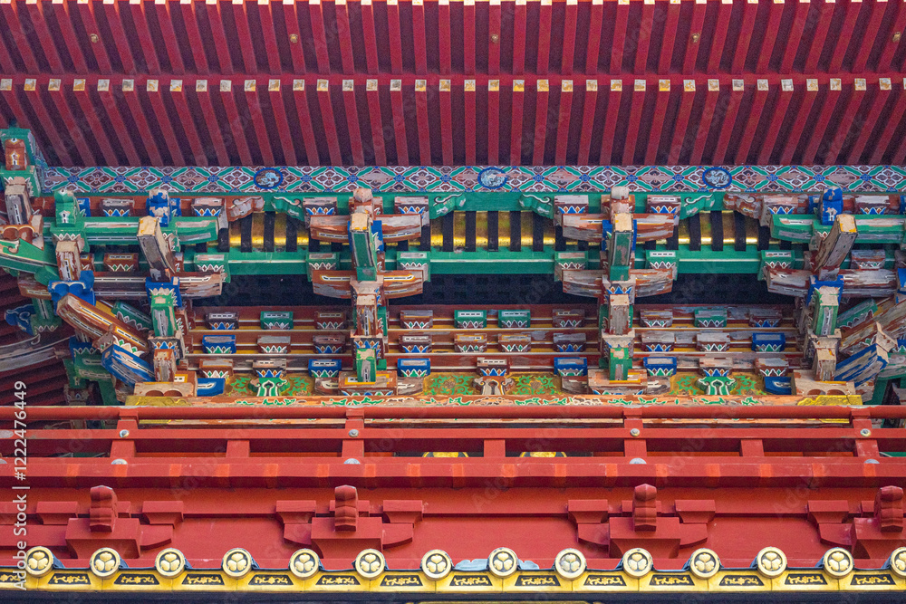 Japanese temple, the colorful roof of the Gojū-no-tō a five-storied pagoda in a place of worship at daytime in winter with sunshine in Nikko in Japan. Japanese temple, the colorful roof of the Gojū-no-tō a five-storied pagoda in a place of worship at daytime in winter with sunshine in Nikko in Japan.