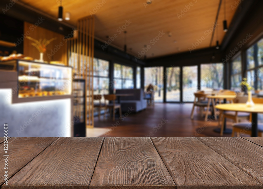 Naklejka premium Empty wooden table in restaurant, space for design