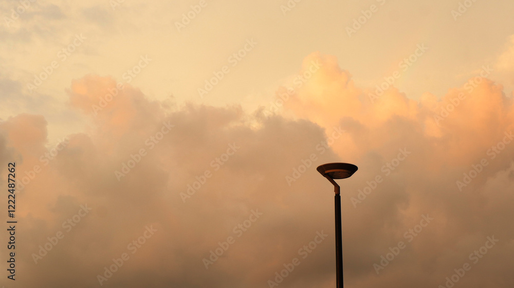 Electric light on blue sky in sunny weather. Lamp for home garden lighting. Electric light on blue sky in sunny weather. Lamp for home garden lighting.