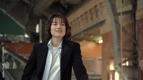 Wallpaper Mural Young woman confidently ascending an escalator in a vibrant shopping mall Torontodigital.ca