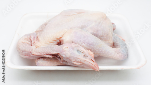 Фотография Raw carcass chicken, ayam kampung in Indonesia isolated on white