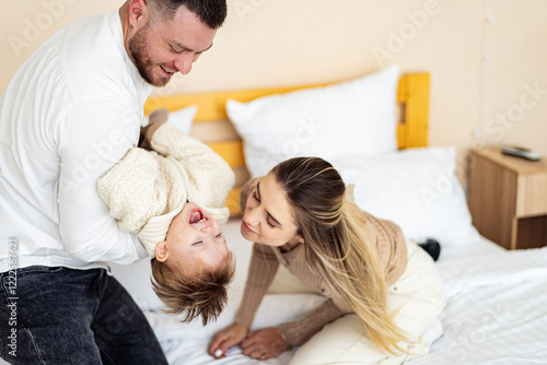 Billede på lærred Family joy during playtime in a bedroom