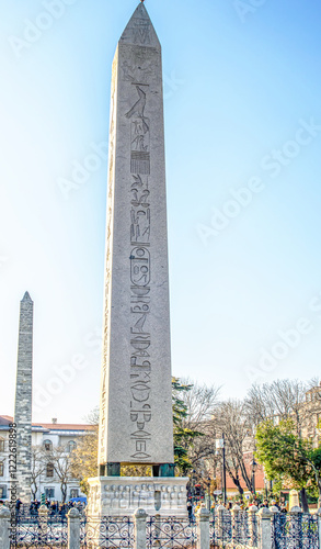 Photography Obelisk of Theodosius and view of the scenes in the blue summer sky, Hippodrome