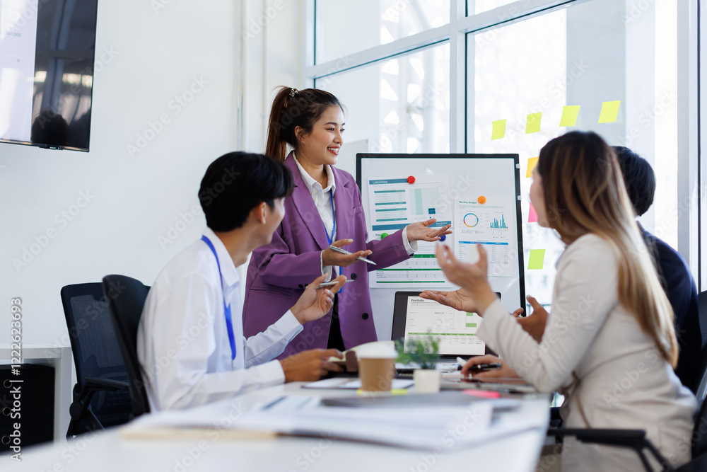 Team Of Asian Business working at the office with documents on desk, planning analyzing the financial report, business plan investment, Consultant, finance analysis concept. Team Of Asian Business working at the office with documents on desk, planning analyzing the financial report, business plan investment, Consultant, finance analysis concept.