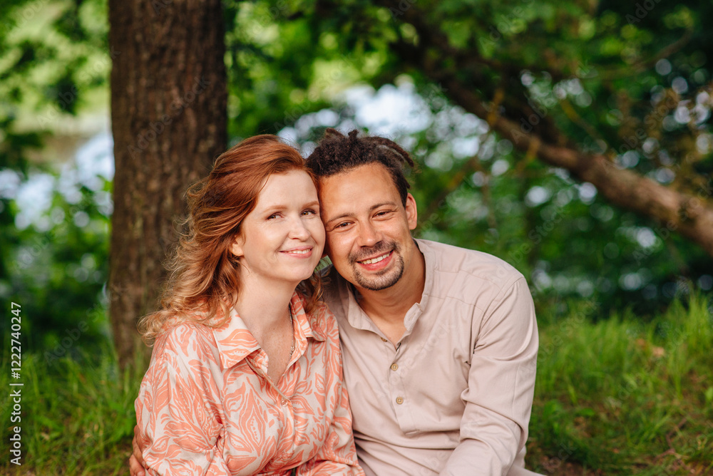Beautiful couple smiling in the park, perfect for themes of love, romance, relationships, happiness and outdoor recreation. Beautiful couple smiling in the park, perfect for themes of love, romance, relationships, happiness and outdoor recreation.