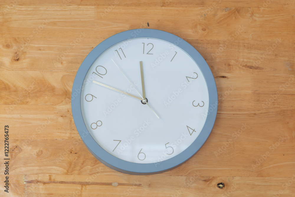 Clock placed in middle of wooden wall Clock placed in middle of wooden wall