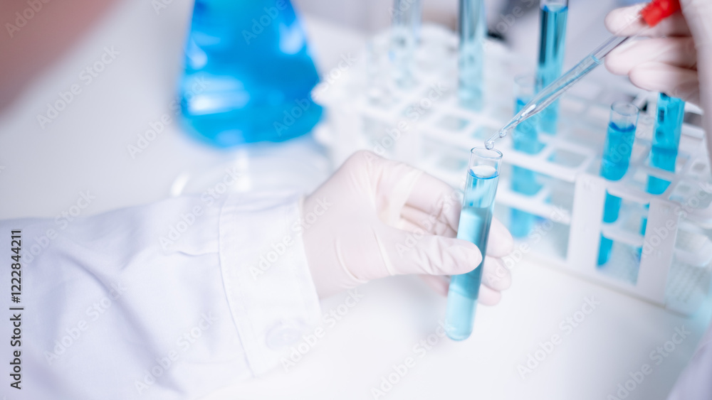 Close-up scientist pipette drop to test tube laboratory research chemistry chemical science research Close-up scientist pipette drop to test tube laboratory research chemistry chemical science research