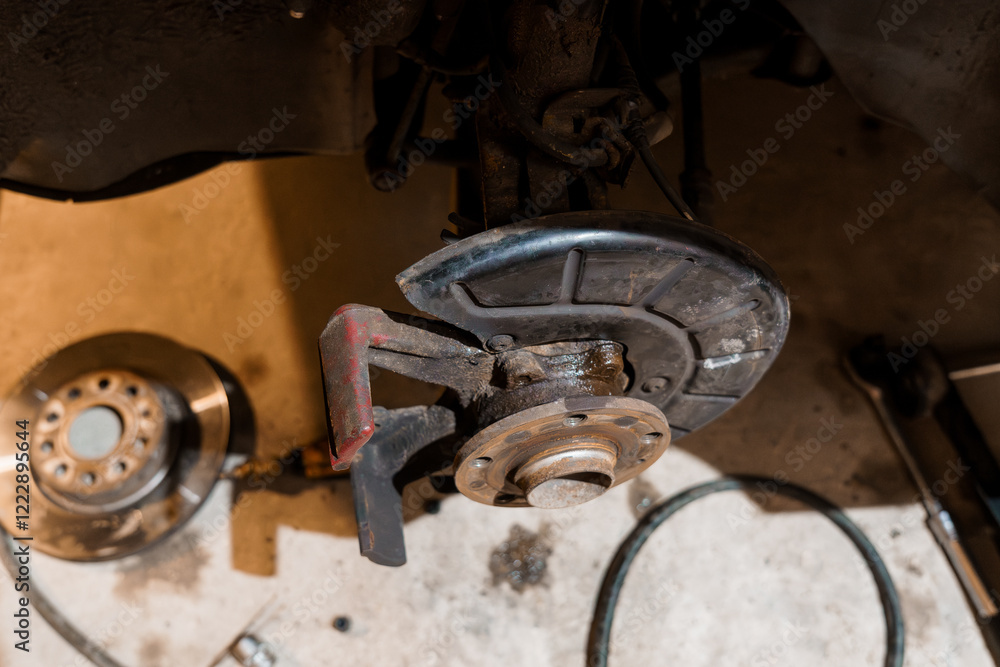 Detailed Close-Up of Automotive Brake System Components in a Workshop Setting Detailed Close-Up of Automotive Brake System Components in a Workshop Setting