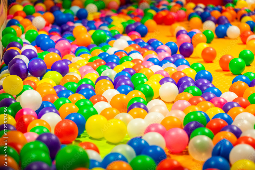 A lively ball pit filled with colorful plastic balls for endless fun and exploration. A lively ball pit filled with colorful plastic balls for endless fun and exploration.