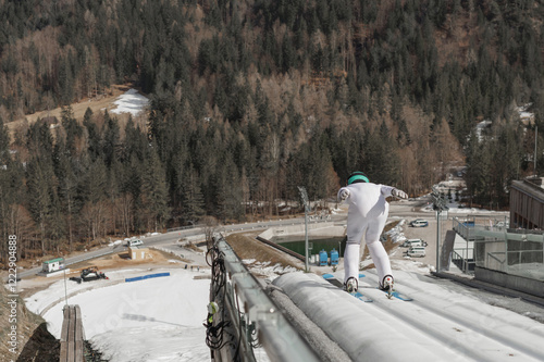 Jumper soaring through the air after takeoff from a ski jump. Extreme winter sports concepts. photo