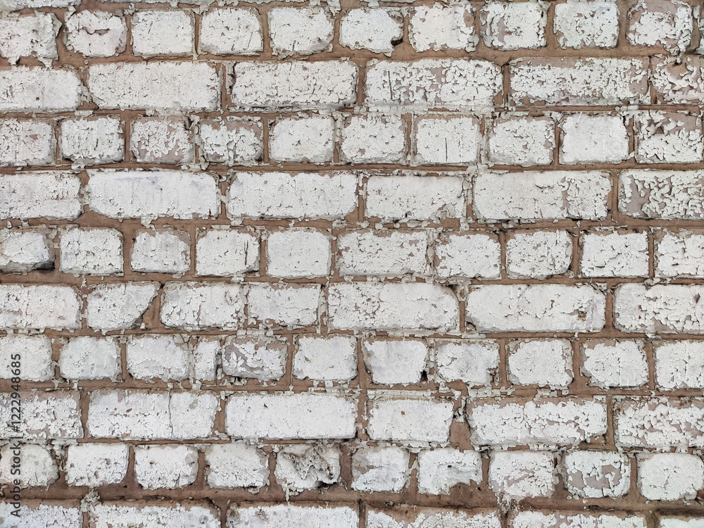 Textured white brick wall with distressed finish, ideal for backgrounds and design projects Textured white brick wall with distressed finish, ideal for backgrounds and design projects