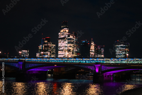 Night scape over London Skyline with Thames river view in England photo