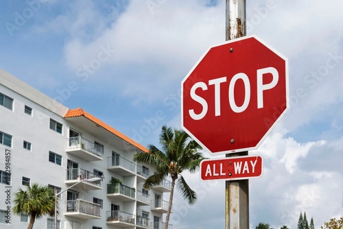 Stop sign against blue sky photo