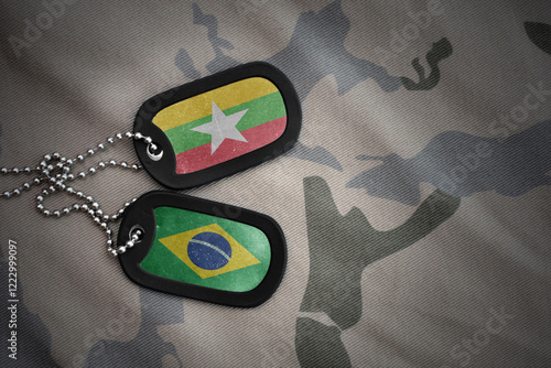 vintage army blank, dog tag with flag of myanmar and brazil on the khaki texture background. military concept. photo