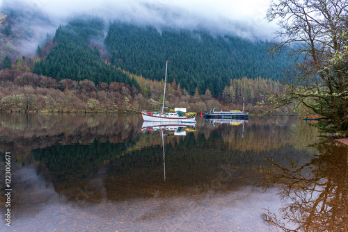 Boats moored at Loch Oich, Scotland, UK photo