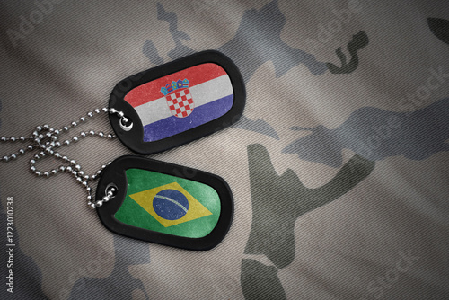 vintage army blank, dog tag with flag of croatia and brazil on the khaki texture background. military concept. photo