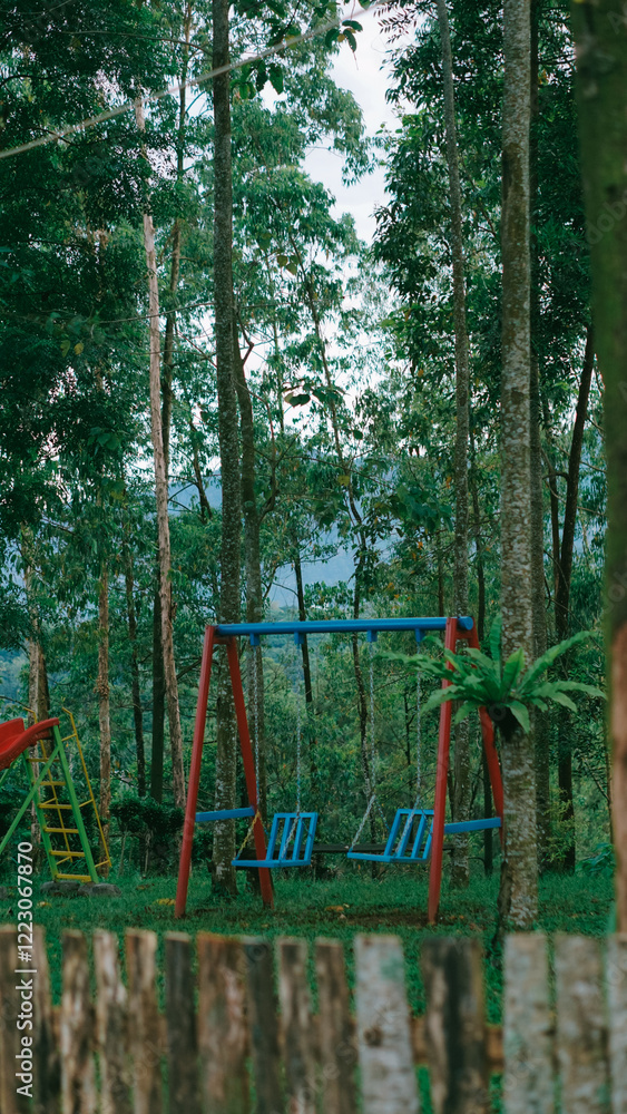 Children's Playground in Forest Setting with Swings Children's Playground in Forest Setting with Swings