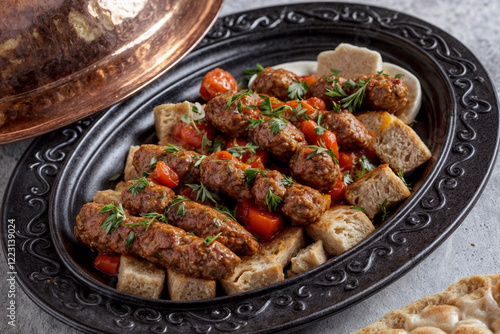 Authentic Turkish and Arabic Iskender Adana Kofte Kebab with parsley, bulgur, and cheese bread, perfect for Ramadan feasts on a rustic wooden background. photo