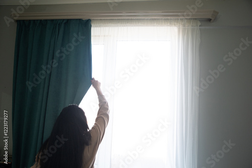 Free Download woman opening curtains in bedroom - GFXLoad
