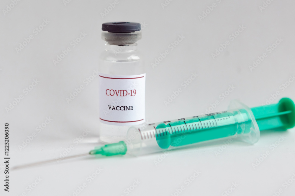 Coronavirus vaccine bottle and syringe injection. Prevention and treatment from corona virus infection. Medicine infectious concept. Coronavirus vaccine bottle and syringe injection. Prevention and treatment from corona virus infection. Medicine infectious concept.