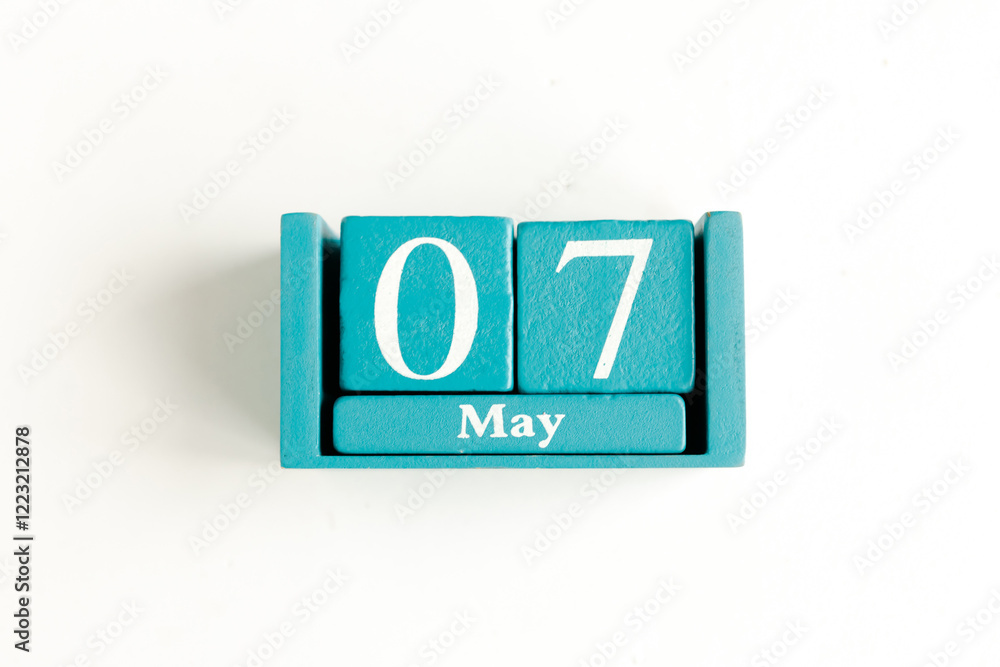 May 7. Blue cube calendar with month date isolated on white background. May 7. Blue cube calendar with month date isolated on white background.
