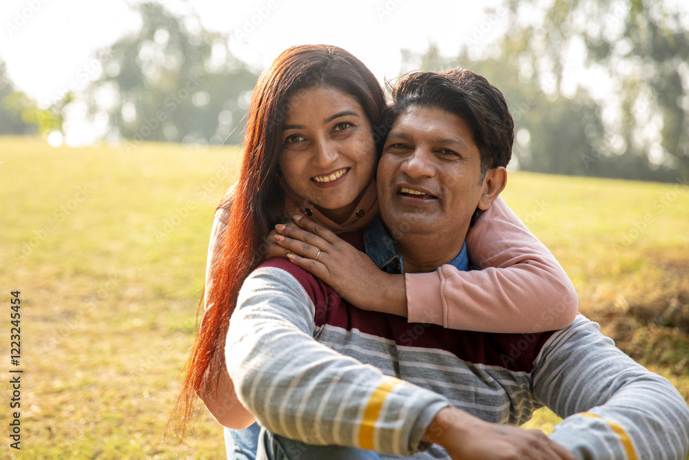 Indian young romantic couple hugging at outdoor. Lovely couple embracing each other at park Indian young romantic couple hugging at outdoor. Lovely couple embracing each other at park