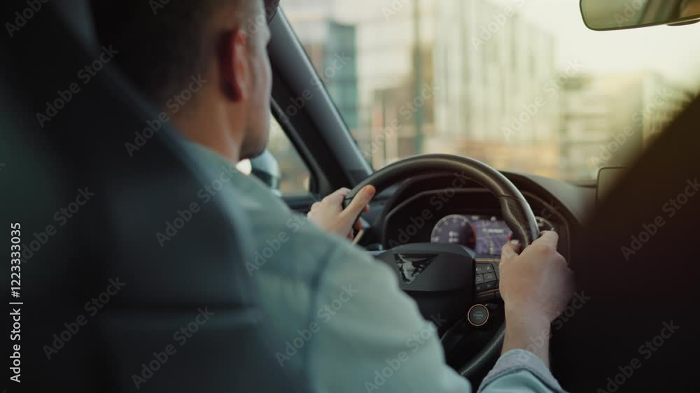 Man driving car through the streets of the city Man driving car through the streets of the city