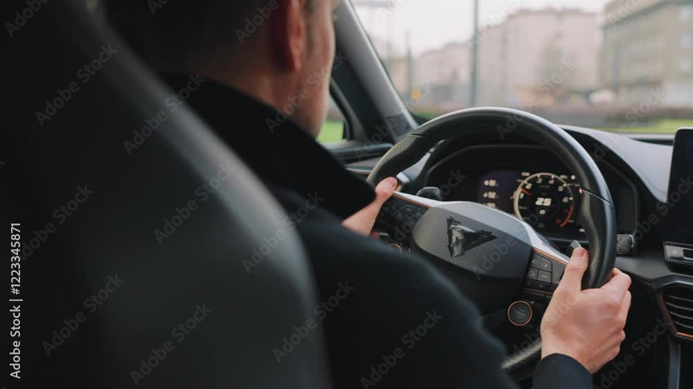 Man driving car through the streets of the city Man driving car through the streets of the city