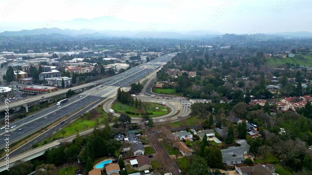 The drone captures a stunning aerial perspective of Walnut Creek, California, showcasing winding roads, neighborhoods, and surrounding hills. This serene landscape highlights urban and natural beauty. The drone captures a stunning aerial perspective of Walnut Creek, California, showcasing winding roads, neighborhoods, and surrounding hills. This serene landscape highlights urban and natural beauty.
