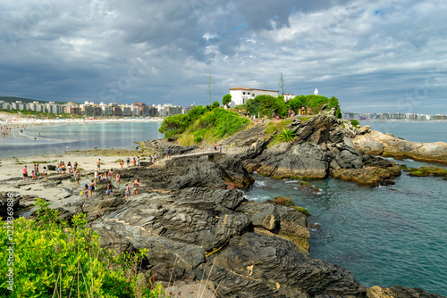 View of Forte de São Matheus with the fort built on large rocks, the sea around it, below the beach of the fort, located in Cabo Frio, coast of Rio de Janeiro, Brazil.