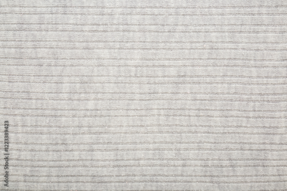 Light gray soft knitted fabric background. Empty place for text. Closeup. Top down view. Light gray soft knitted fabric background. Empty place for text. Closeup. Top down view.