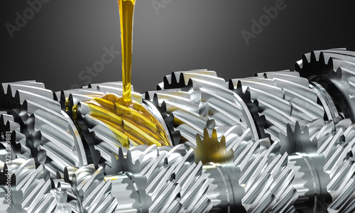 Fotografie Golden oil flowing over silver gears in motion