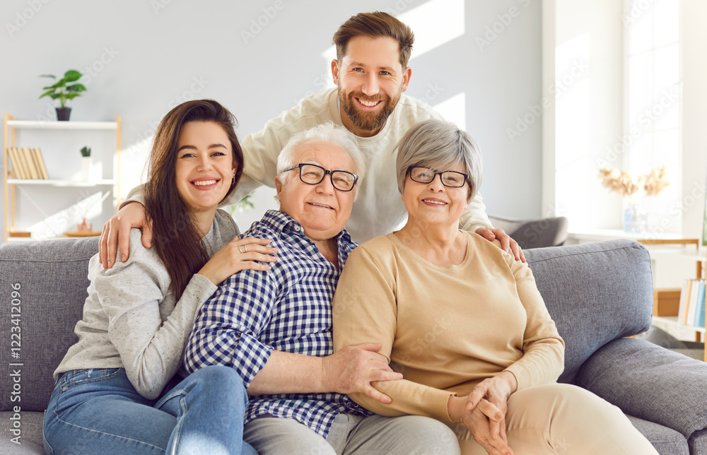 Portrait of a happy family at home, elderly parents or old grandparents, an adult son, and a daughter, smiling and embracing at home. Love and togetherness between grandparents and children. Portrait of a happy family at home, elderly parents or old grandparents, an adult son, and a daughter, smiling and embracing at home. Love and togetherness between grandparents and children.
