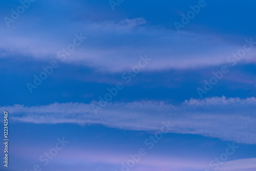 Bild auf Leinwand Striated clouds at twilight a serene and colorful sky