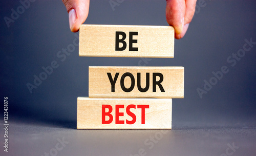 Motivational be your best symbol. Concept words Be your best on beautiful wooden blocks. Beautiful grey background. Businessman hand. Business motivational be your best concept. Copy space. photo