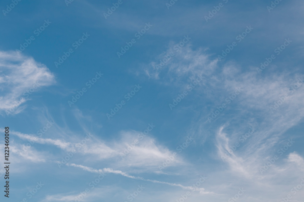Typical white thin clouds in the blue sky. Typical white thin clouds in the blue sky.