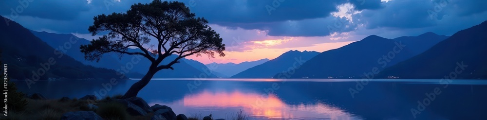 Fototapeta premium serene tree silhouetted by lake and mountains at night, nature, scenery, landscape