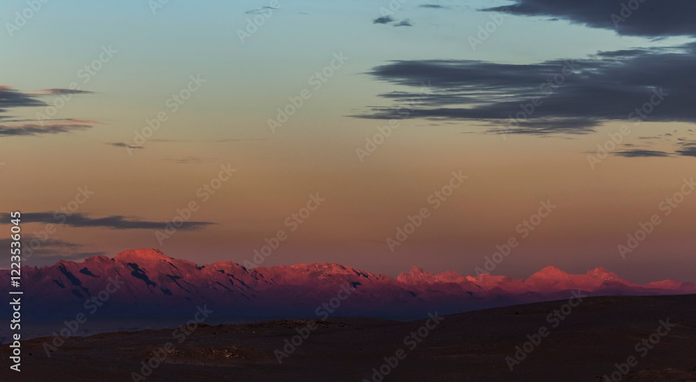 Sunrise over the mountains in a desert area creating a fine dawn background. Sunrise over the mountains in a desert area creating a fine dawn background.