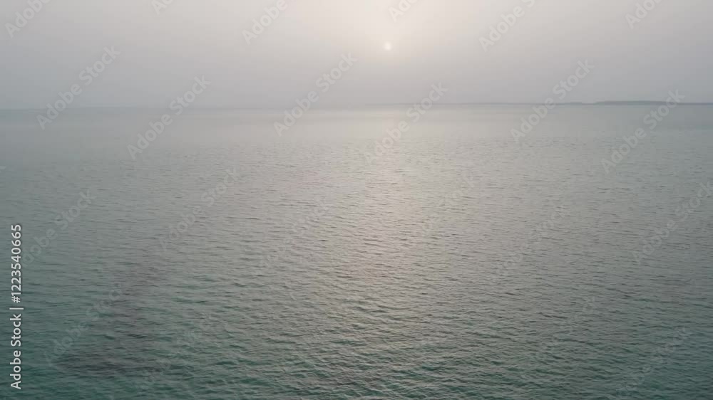Aerial View of the Expansive and Endless Sea Under a Clear Sky Aerial View of the Expansive and Endless Sea Under a Clear Sky