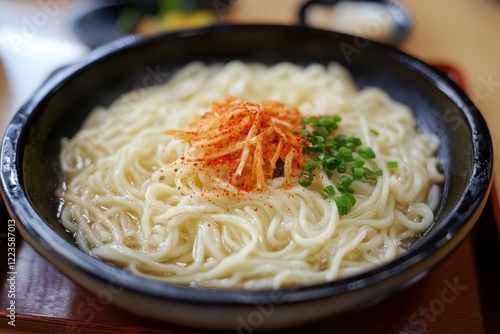 Uncooked Kalguksu served on a tray photo