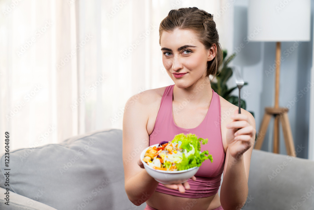 Healthy sporty and vegetarian woman in sportswear with a bowl of fruit and vegetable. Healthy cuisine nutrition and vegan lifestyle for fitness body physique at gaiety home concept. Healthy sporty and vegetarian woman in sportswear with a bowl of fruit and vegetable. Healthy cuisine nutrition and vegan lifestyle for fitness body physique at gaiety home concept.
