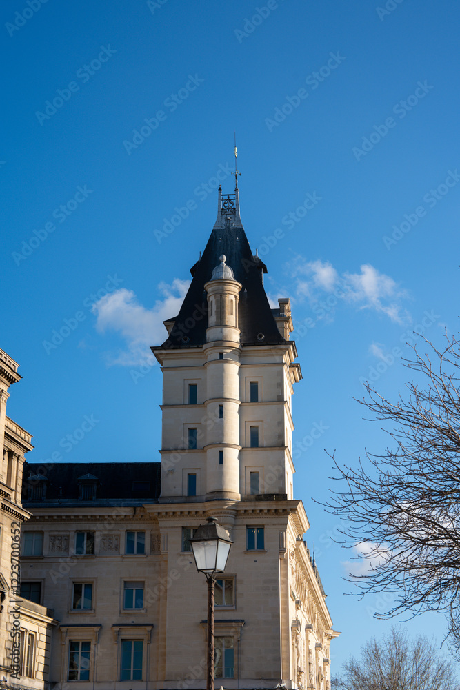 Majestic tower piercing the clear blue sky in a historic European city Majestic tower piercing the clear blue sky in a historic European city