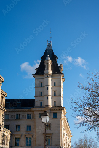 Majestic tower piercing the clear blue sky in a historic European city photo