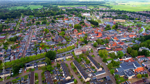 A wide aerial panorama shot around the old town of the city Kollum on a sunny summer day in the Netherlands  photo