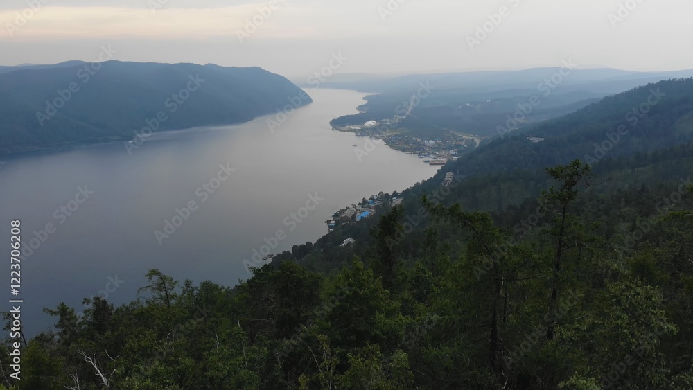 Lake Baikal in the evening. Yenisei river meandering through rugged siberian mountains, revealing pristine wilderness and serene natural expanse Lake Baikal in the evening. Yenisei river meandering through rugged siberian mountains, revealing pristine wilderness and serene natural expanse