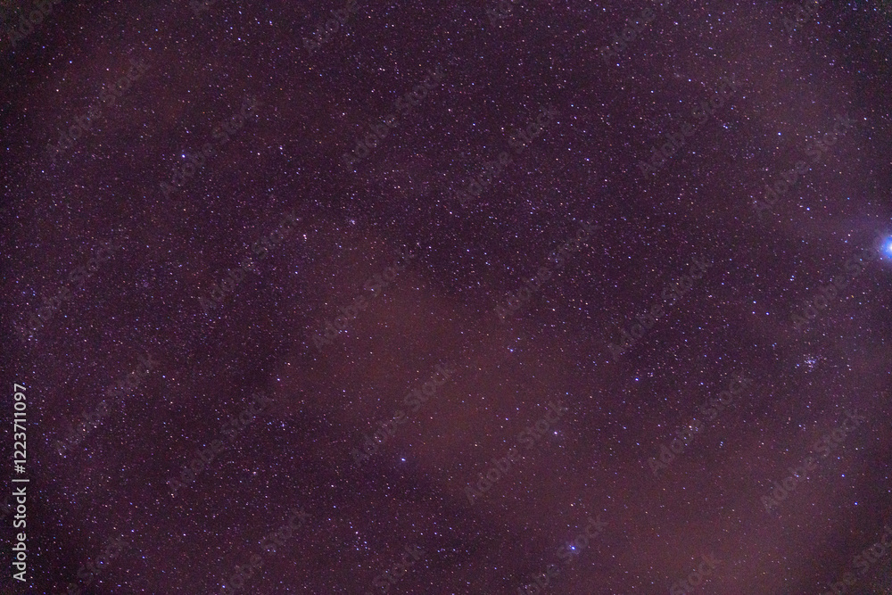 Fototapeta premium Constellation of stars on a cloudy day, clouds covering the stars.