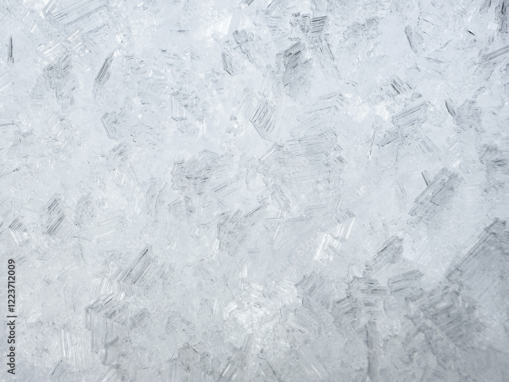 Obraz premium close-up of ice crystals pattern. frosty pattern. nature pattern. frozen water texture. winter frost. ice texture. white minimalistic background