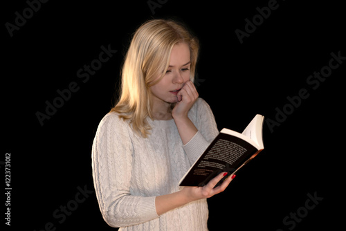 Focused Woman Reading a Book in Thoughtful Mood